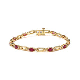 1/10 Ct. T.W. Oval Ruby and Diamond Bar Prong-Set Bracelet in 10K Yellow Gold