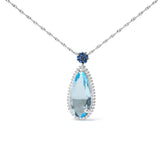 3/8 Ct. T.W. Diamond, Sky Blue Topaz and Blue Sapphire Floral Teardrop Halo Pendant Necklace in 18K White Gold