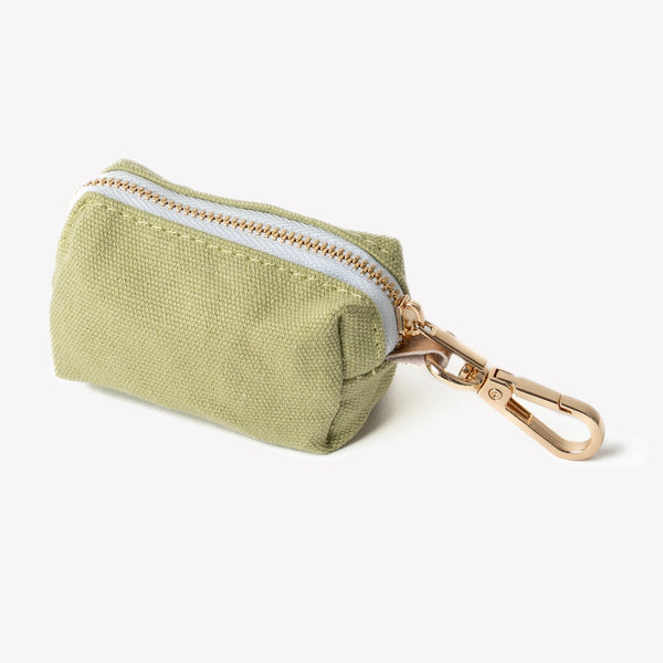 Green poop bag holder, zip pouch close-up
