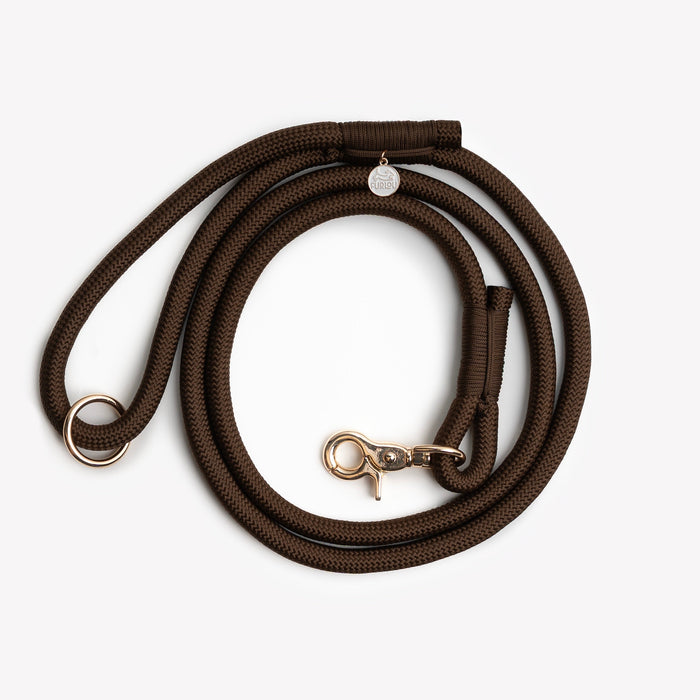 Brown braided rope leash, coiled
