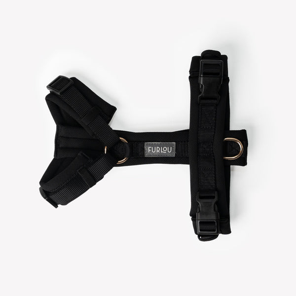Black comfort dog harness laid flat