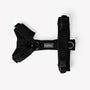 Black comfort dog harness laid flat