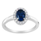 Anillo de cóctel con halo, diamantes redondos de 1/5 ct. p.t. y piedra de garras de 7 mm en oro blanco de 10K