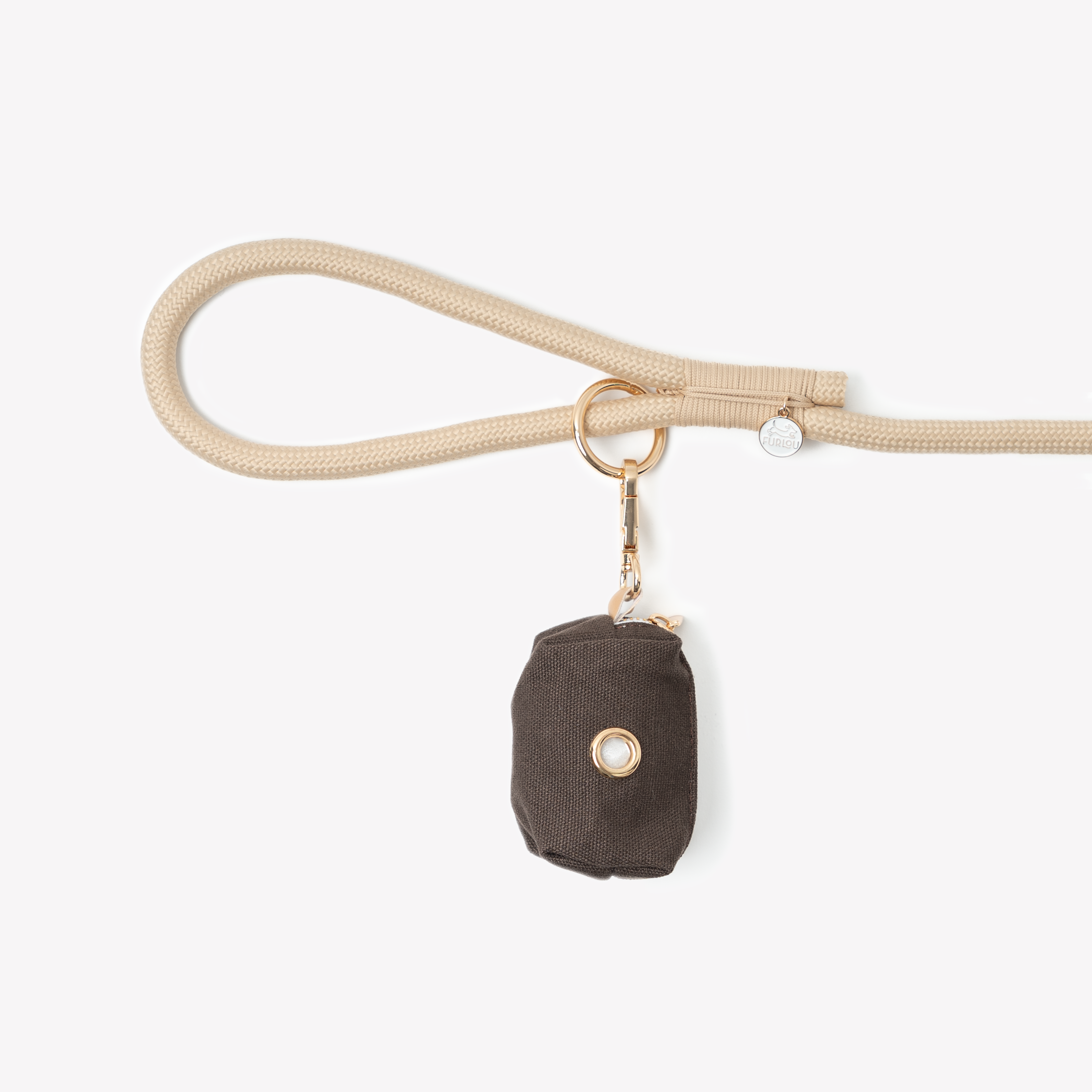 Brown poop bag holder clipped to a leash handle