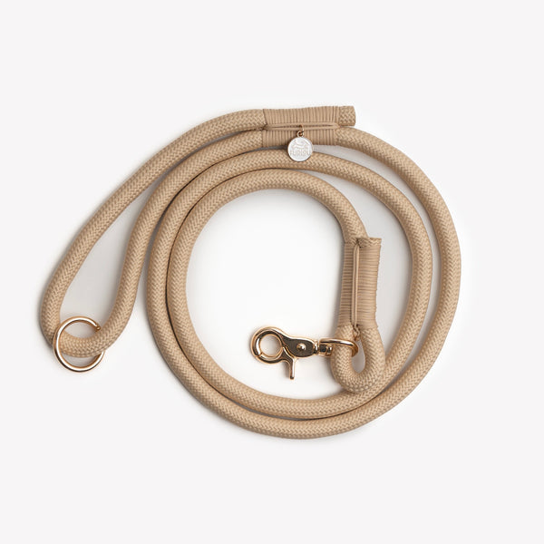 Tan braided rope leash, coiled