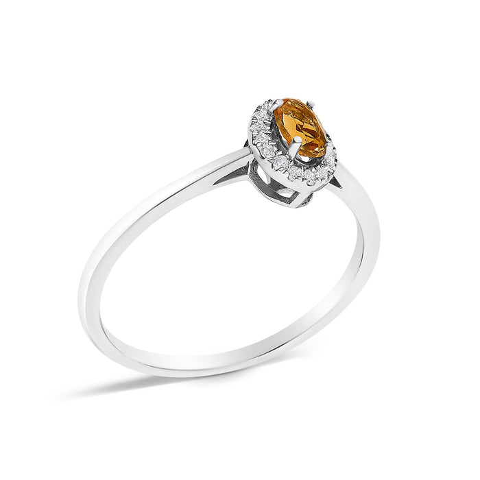 Anillo de halo con piedra natal ovalada de 5x3mm y detalle de diamante en oro blanco de 10K, foto 41