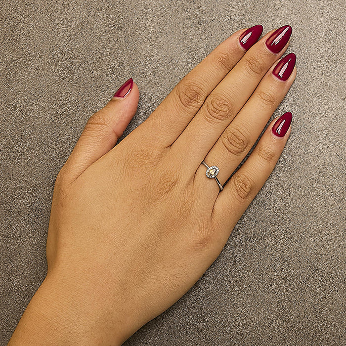 Anillo de halo con piedra natal ovalada de 5x3mm y detalle de diamante en oro blanco de 10K, foto 30