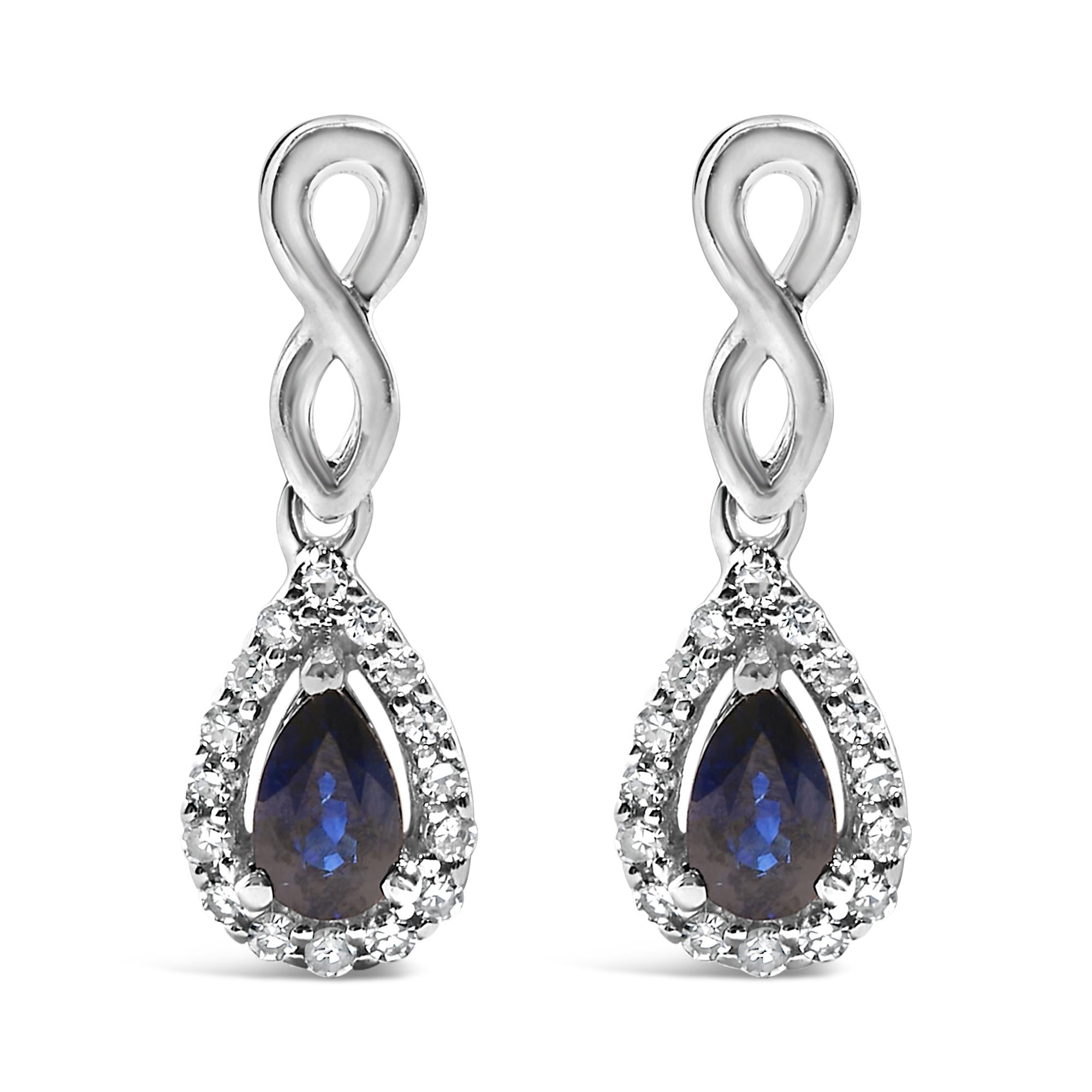 Aretes colgantes de infinito con zafiro azul de talla pera y diamantes de 1/7 ct. p.t. en oro blanco de 10K, foto 1