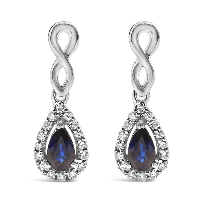 Aretes colgantes de infinito con zafiro azul de talla pera y diamantes de 1/7 ct. p.t. en oro blanco de 10K, foto 1