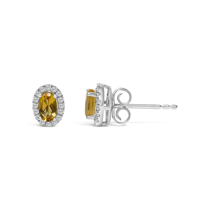 Aretes de botón de halo con piedra natal talla ovalada de 5x3mm y diamantes en oro blanco de 10K, foto 41