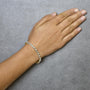 4 Ct. T.W. Diamond Triangle Link Tennis Bracelet in 14K Yellow Gold, photo 3