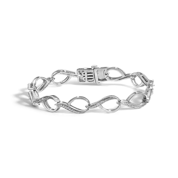 Pulsera de eslabones de remolino con detalle de diamante de 1/10 ct. p.t. en plata de ley, foto 1
