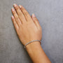 Pulsera tenis de eslabones en S con Miracle Plate redondo y diamantes de 1/10 ct. p.t. en plata de ley, foto 9