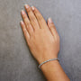 Pulsera tenis de eslabones en S con Miracle Plate redondo y diamantes de 1/10 ct. p.t. en plata de ley, foto 8