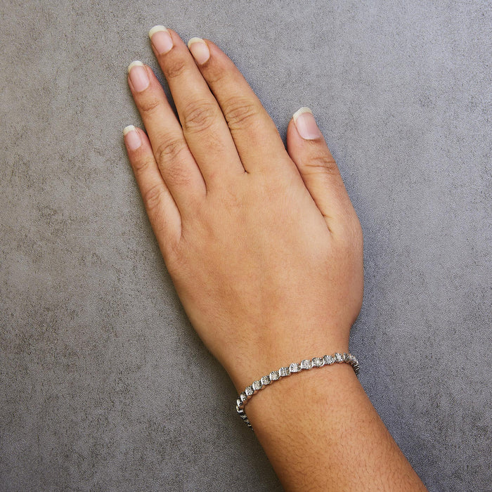 Pulsera tenis de eslabones en S con Miracle Plate redondo y diamantes de 1/10 ct. p.t. en plata de ley, foto 8