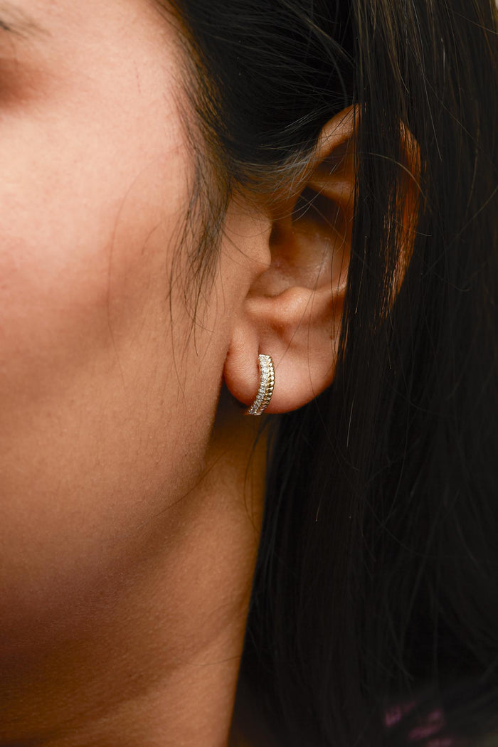 1/10 Ct. T.W. Diamond and Rope Twist Huggy Hoop Earrings in 10K Yellow Gold, photo 3