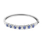 Brazalete rígido con tanzanita azul ovalada de 5mm y diamantes de 1/4 ct. p.t. en oro blanco de 14K, foto 1