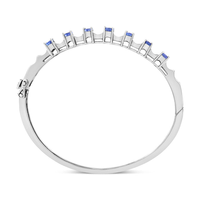 Brazalete rígido con tanzanita azul ovalada de 5mm y diamantes de 1/4 ct. p.t. en oro blanco de 14K, foto 5