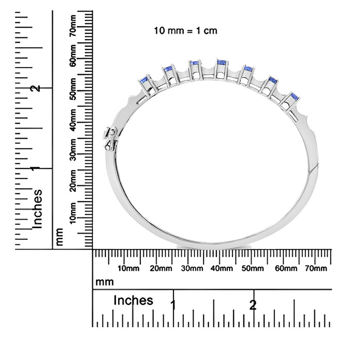 Brazalete rígido con tanzanita azul ovalada de 5mm y diamantes de 1/4 ct. p.t. en oro blanco de 14K, foto 6