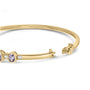 Brazalete rígido de bisel alterno con tanzanita ovalada de 5 mm y diamantes de 1/5 ct. p.t. en oro amarillo de 14K, foto 2