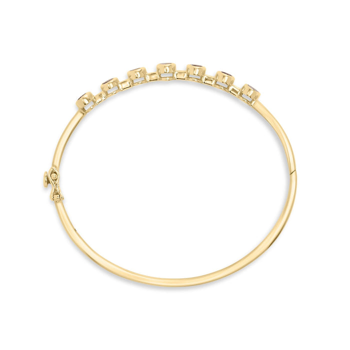Brazalete rígido de bisel alterno con tanzanita ovalada de 5 mm y diamantes de 1/5 ct. p.t. en oro amarillo de 14K, foto 4