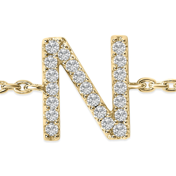 Pulsera de eslabones con dije de inicial A-Z y detalle de diamante en oro amarillo de 10K