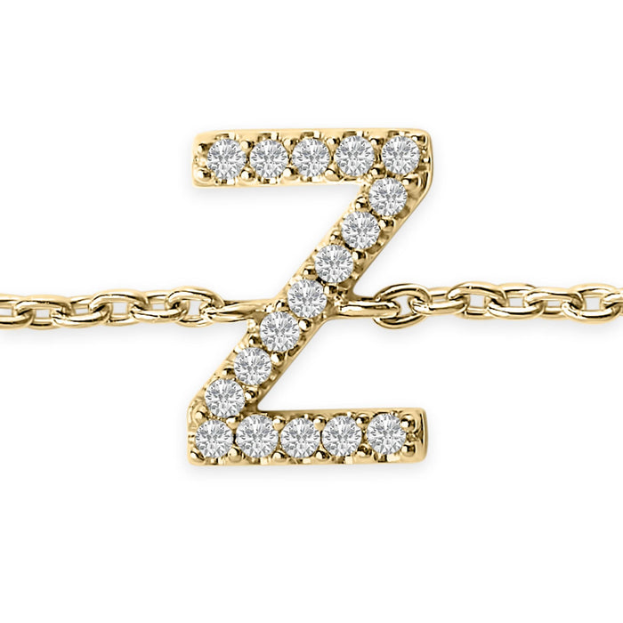 Pulsera de eslabones con dije de inicial A-Z y detalle de diamante en oro amarillo de 10K