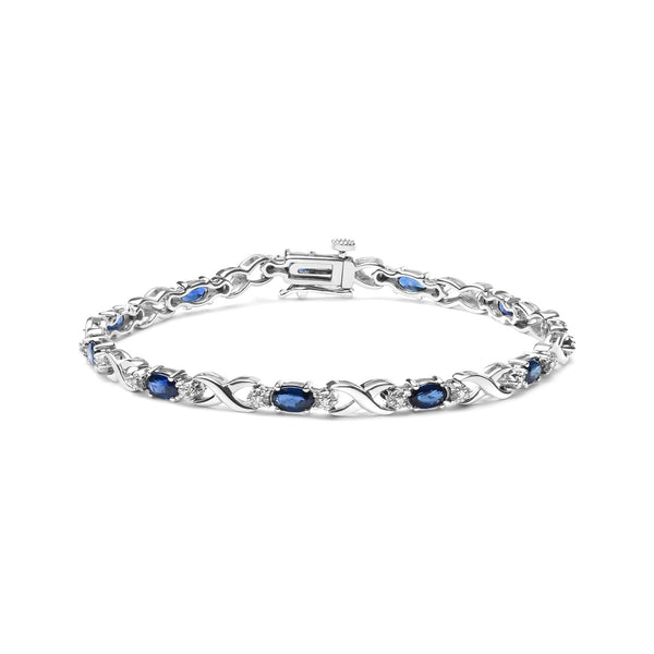 1/10 Ct. T.W. 5x4mm Oval Sapphire Gemstone and Diamond Prong-Set X Link Bracelet in 10K White Gold, photo 1