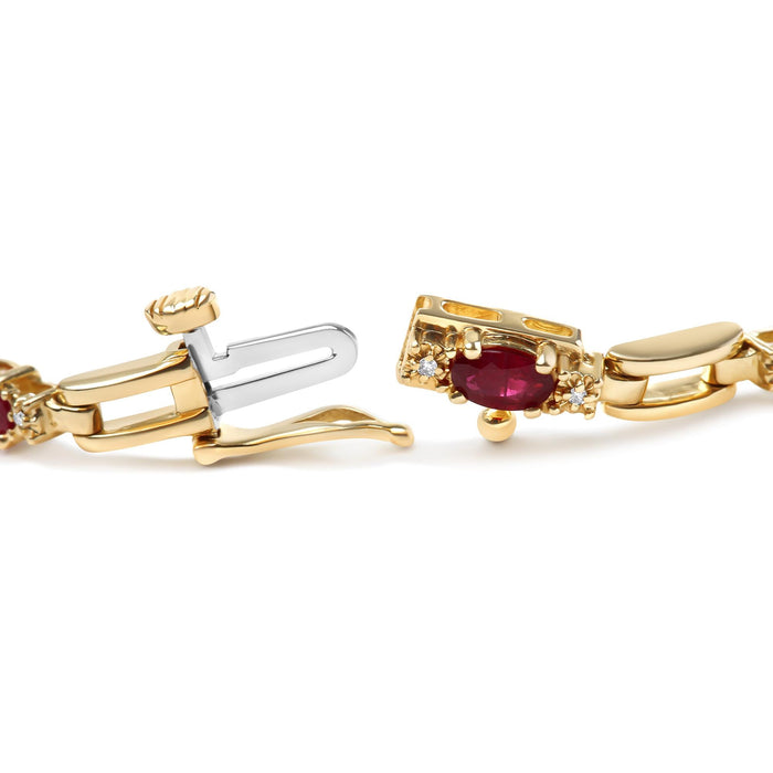1/10 Ct. T.W. Oval Ruby and Diamond Bar Prong-Set Bracelet in 10K Yellow Gold, photo 2