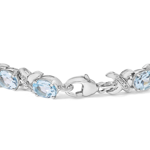 Pulsera tenis de eslabones en X con topacio azul ovalado de 16 ct. p.t. y detalle de diamante en plata de ley, foto 2