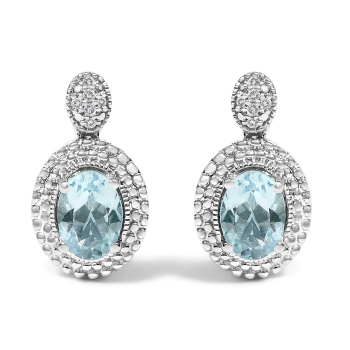 Aretes de botón colgantes con detalle de diamante, topacio azul ovalado y halo de cuentas en plata de ley, foto 1