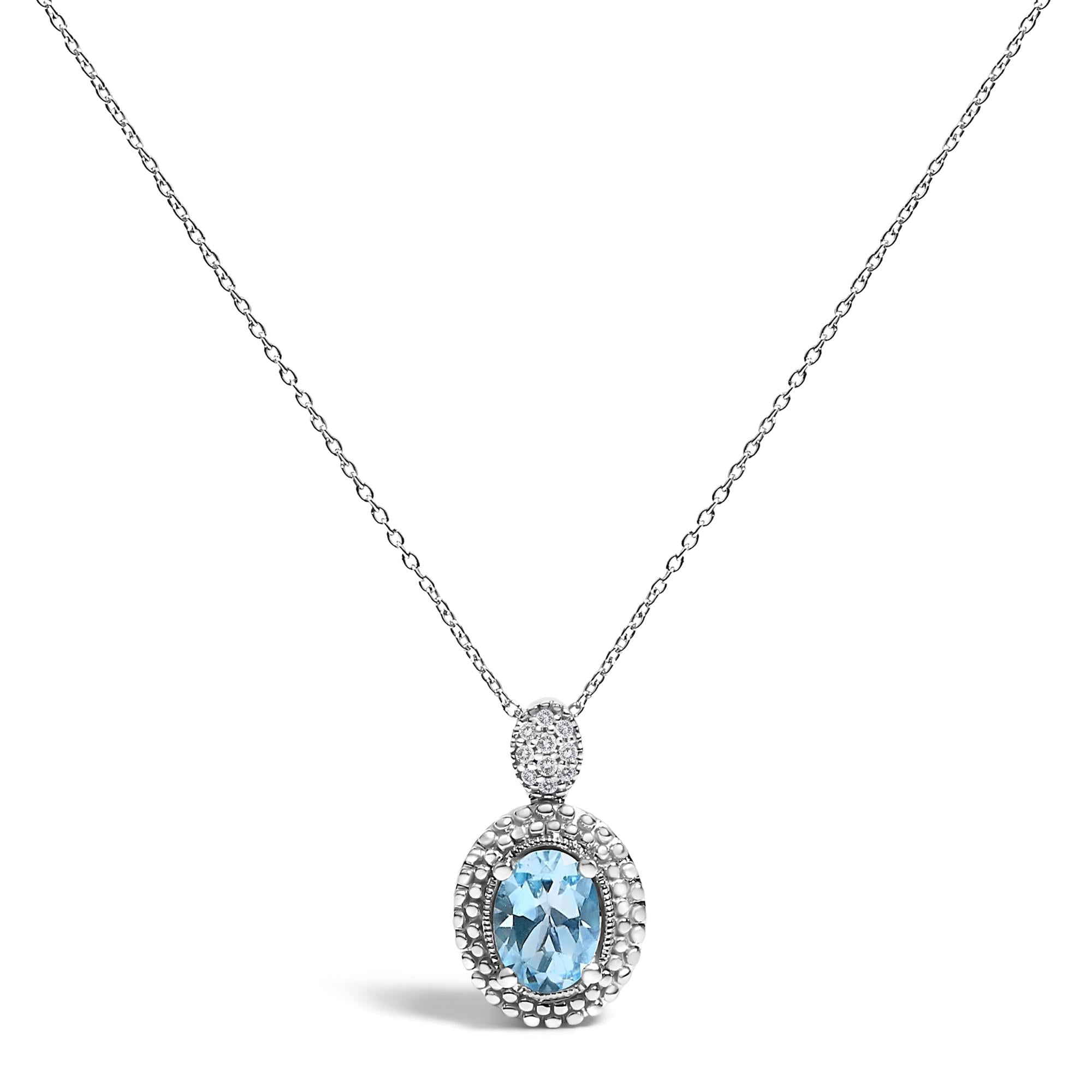Collar con colgante de topacio azul ovalado y detalle de diamante con halo de cuentas en plata de ley, foto 1