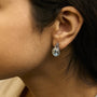 Oval Blue Topaz and Diamond Accent Twist and Halo Drop Earrings in Sterling Silver, photo 3
