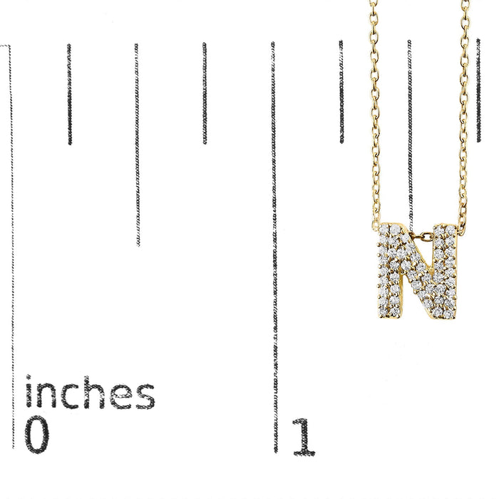 Collar con colgante de inicial A-Z estilo burbuja con detalle de diamante en oro amarillo de 10K