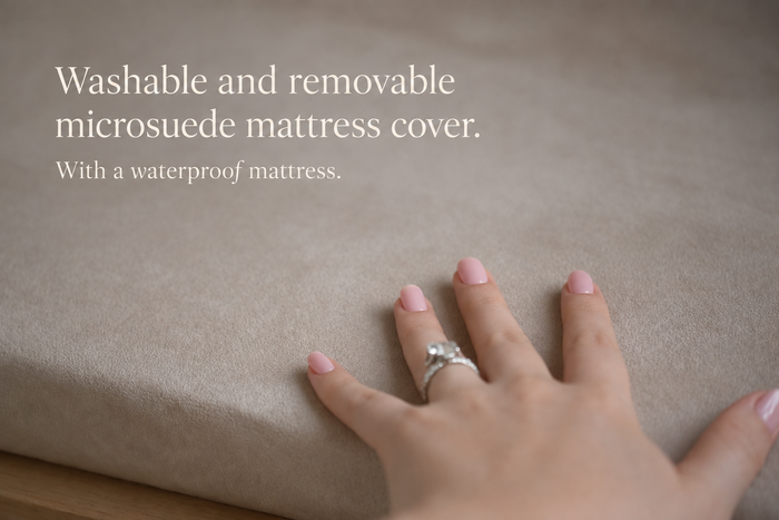Hand pressing the Haven's removable microsuede mattress cover