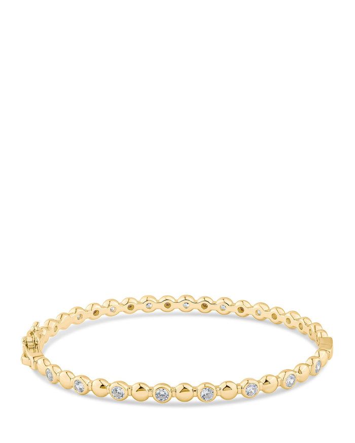 Brazalete rígido alternado de zirconias cúbicas redondas y metal en latón bañado en oro o en rodio, foto 1