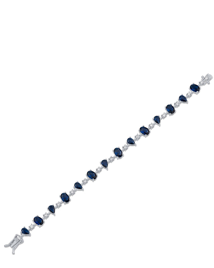 Pulsera tenis con zirconias cúbicas de varias formas y azules en latón bañado en rodio, foto 2