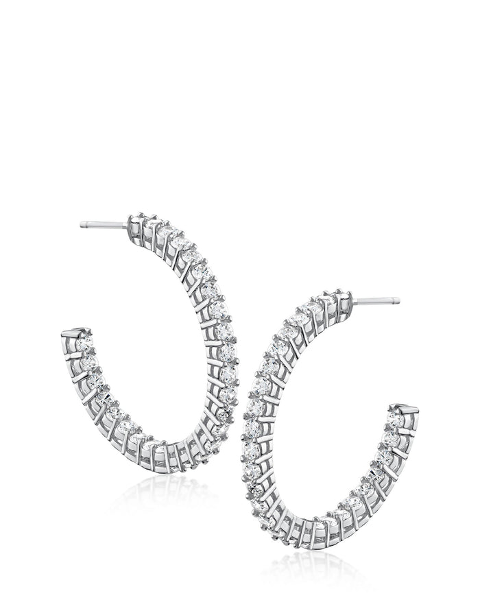 Aretes de aro inside-out redondos con zirconias cúbicas en latón bañado en rodio, foto 1