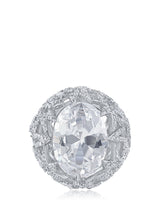 Anillo con zirconia cúbica ovalada y engaste pavé en forma de estrella en latón bañado en rodio