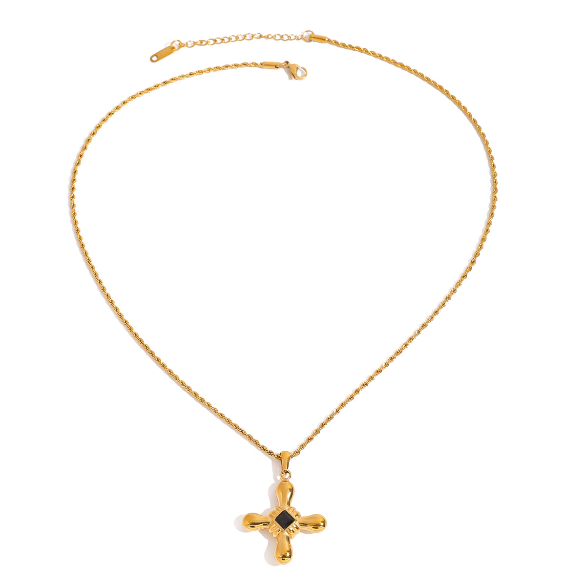 Gold tone pendant necklace, 18K gold plated, on a fine cable chain with a rounded cross pendant and black center accent, lobster clasp and extender visible, no other stones visible.