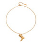 Gold tone pendant necklace, 18K gold plated, on a fine cable chain with an etched cowgirl boot charm and tiny clear crystal accent, lobster clasp and extender visible.