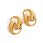 Gold tone stud earrings, 18K gold plated, shaped as interlocked domed loop forms with smooth rounded edges and a mirror high-polish finish, no stones visible, post visible.