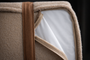 Boucle cover unzipped to show the waterproof liner of the Modern Day dog bed
