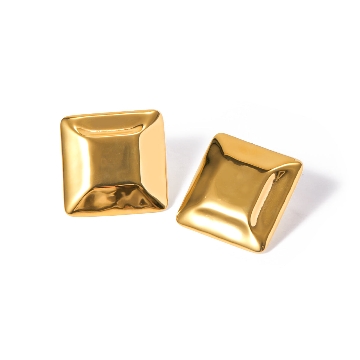 Gold tone stud earrings, 18K gold plated, shaped as puffed square domed studs with smooth rounded edges and a mirror high-polish finish, no stones visible, post-back not visible.