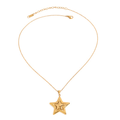 Gold tone pendant necklace, 18K gold plated, on a fine cable chain with a puffed sculpted star pendant in a high-polish finish, lobster clasp and extender visible, no stones visible.