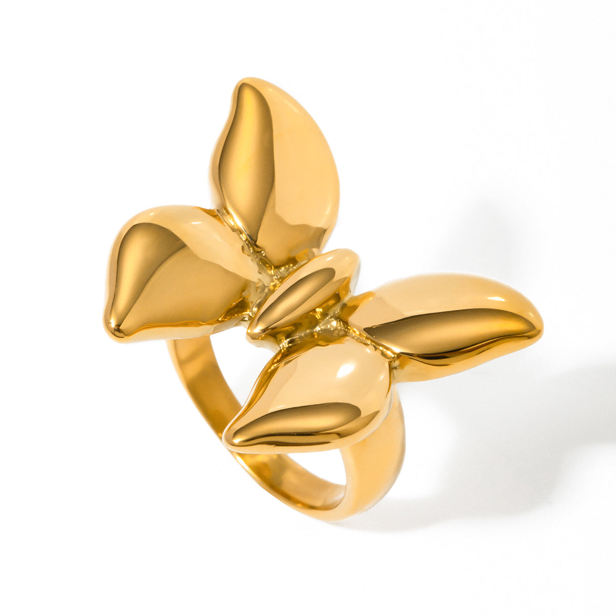 Gold tone statement ring, 18K gold plated, shaped as a five-petal flower with smooth sculpted petals and a mirror high-polish finish, no stones visible.