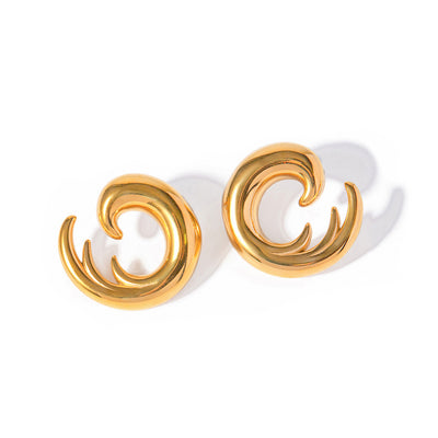 Gold tone stud earrings, 18K gold plated, shaped as curled wave-like spiral forms with smooth rounded edges and a mirror high-polish finish, no stones visible, post-back not visible.