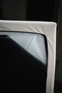 Close-up of the Haven's zip-off cover over the waterproof mattress liner
