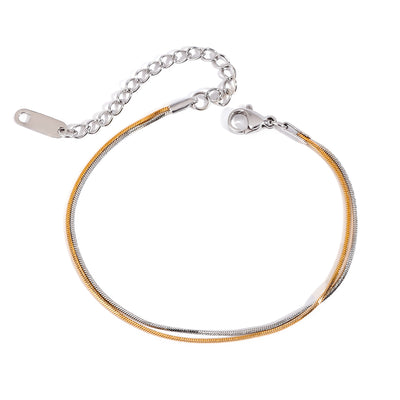 Two tone gold tone and silver tone snake chain bracelet, 18K gold plated, with a smooth snake chain and lobster clasp, extender chain visible, no stones visible.
