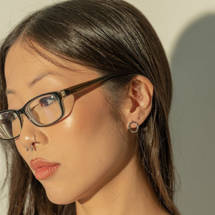 Aretes de botón Wink dispares, foto 4